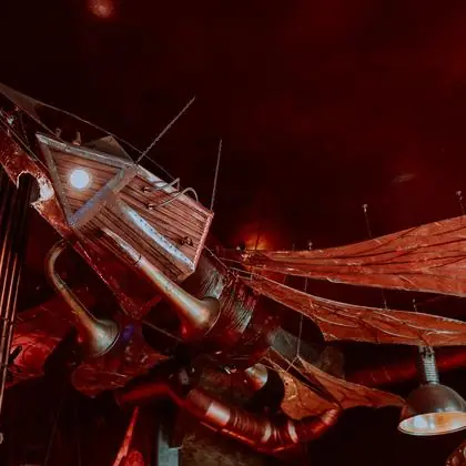 The mechanical dragonfly, hanging above the ground floor