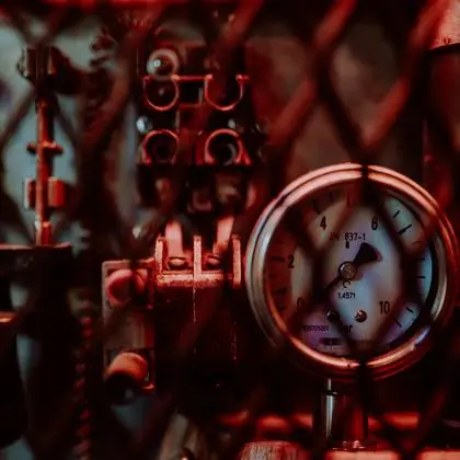 A pressure gauge behind the grille