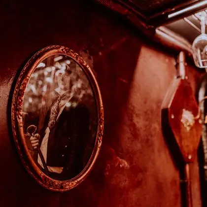 The oval mirror above the counter